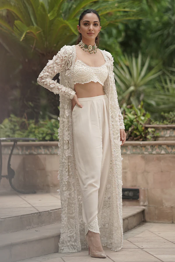 White pants and Shrug by Ridhima Bhasin