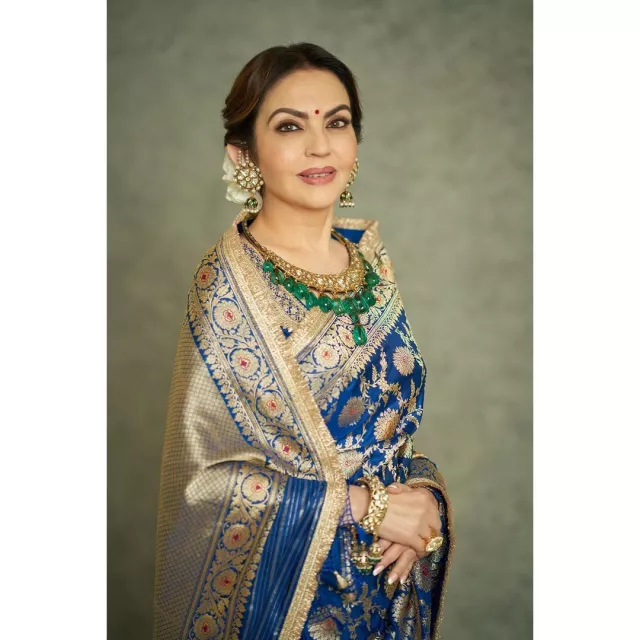 Nita Ambani wearing a jadau neckpiece with emerald drops