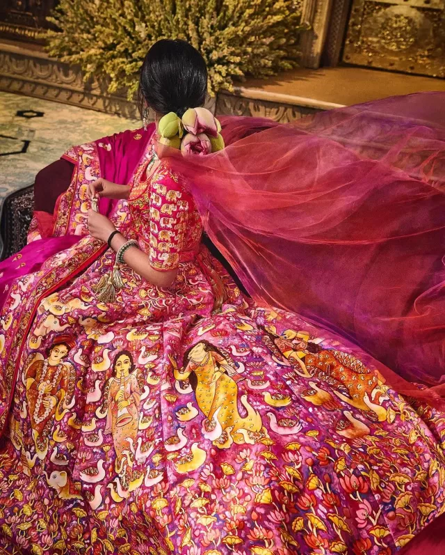 Radhika's unique floral hair do with fresh lotus flowers